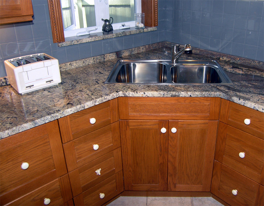 kitchen cabinet with sink and rangehood